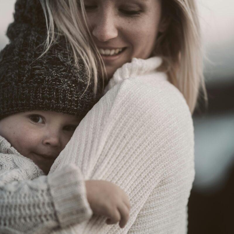 mom holding baby