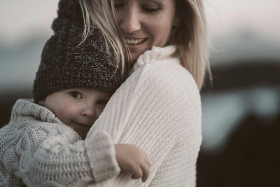 mom holding baby